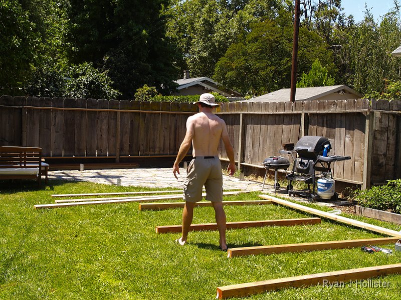 _6169674.JPG - Wanting to take advantage of the unusually cool & overcast June weather, I got started bright and early at noon.   First thing I did was lay out the 4X4 redwood beams and attached the 2X6's to make the left & right side of the pergola.