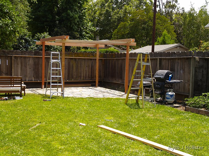 _6169684.JPG - Piece of cake.  After putting these boards up, we screwed in 18 evenly spaced diamond-shaped 2x6 holders that would support the cross beams.