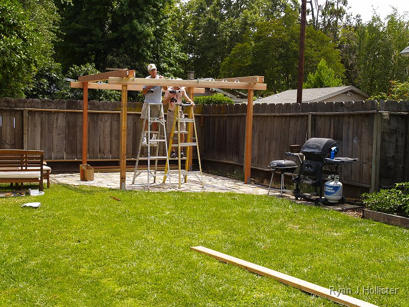 _6169685.JPG - After putting these boards up, we screwed in 18 evenly spaced diamond-shaped 2x6 holders that would support the cross beams.