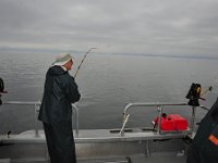 Pop's reels in his first salmon of the day.