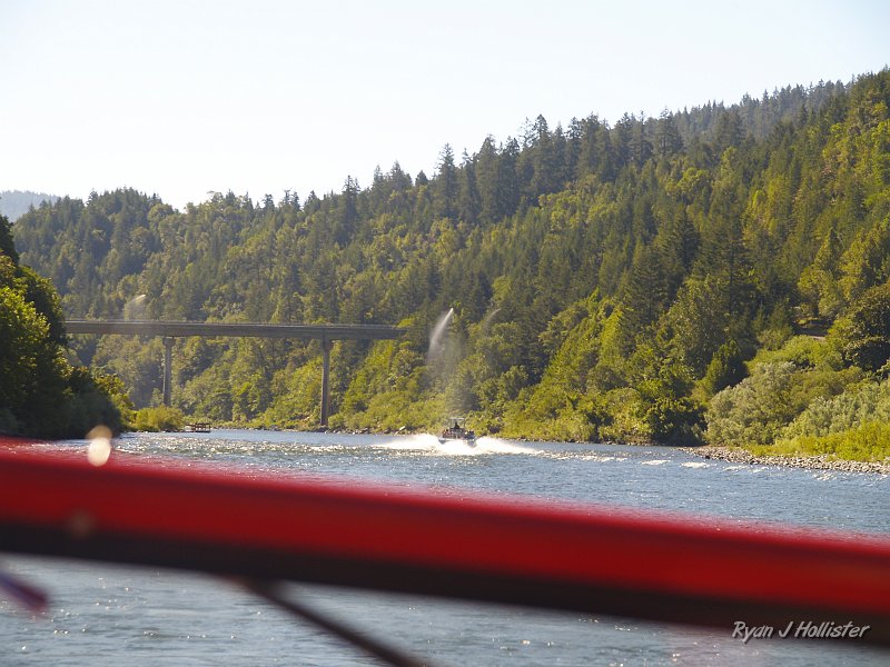 _7210504.JPG - Near Agness. A spring-fed water pipe that is suspended across the river has sprung a leak!