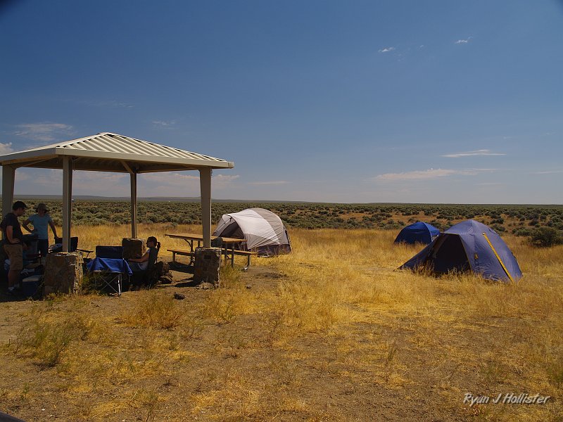 _7180297.JPG - For some odd reason, Oregon thought it would be lovely to supply rockhounds with a sunshade while they camped.  We were thankful that the state was looking out for us this far out in the sticks.  Tents from L-R = Boggeri, Kiriakou, Hollister.