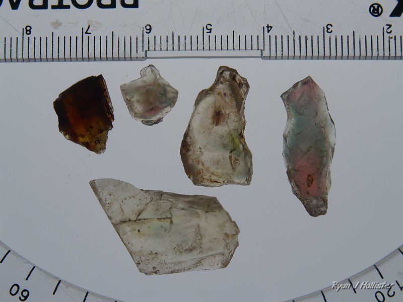 _7240559.JPG - These were my best four specimens in terms of color.  The stone on the right had the mine owner drooling.  Greens are very rare in sunstones.