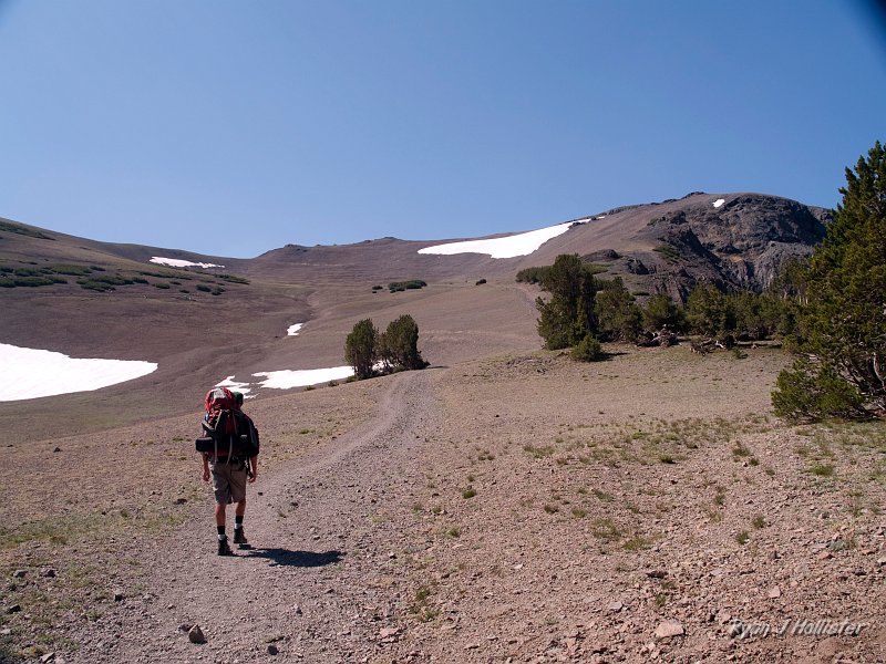 20090810_high_emigrant_lake_0170.jpg - Steve headed up to Leavitt Pass.  The trail we walked was originally a road constructed during WWII to allow mining access to Tungsten deposits.  Those operations went kaput in the early 60's, but the road remains open to hikers only.