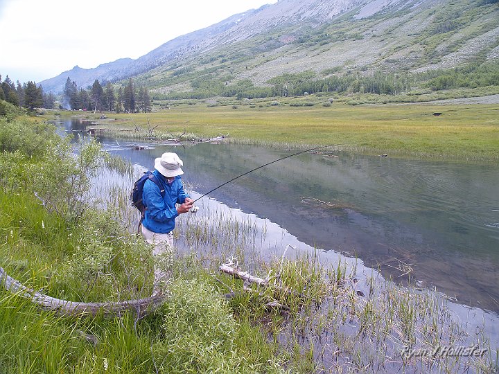 _6309993.JPG - Our horses were a little slow getting up the trail, so we only had a measly 45 minutes to fish the lake.  It felt good to walk around, as I Was already getting saddle sore.   My dad was the first to hook-up.