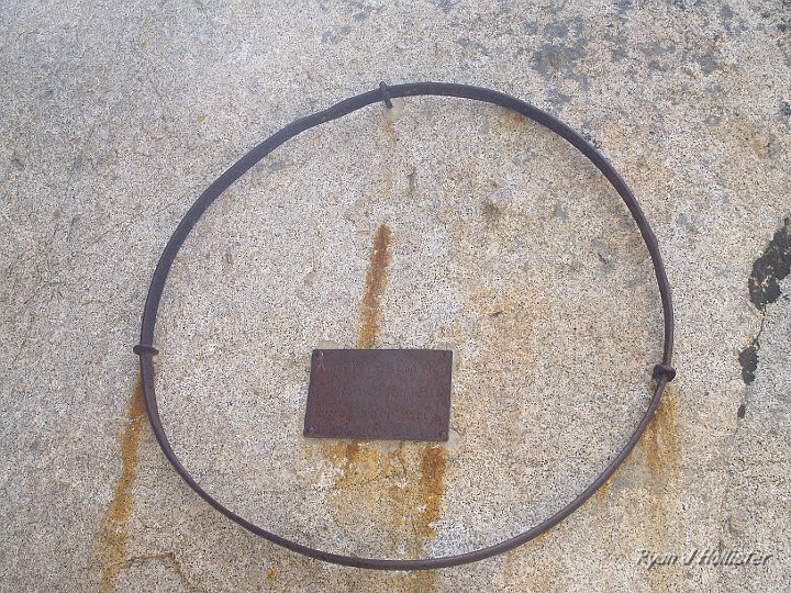 _6199759.JPG - This was an unexpected site.  It was a wagon wheel with a plaque that read "Wheel and Sand Plate: Part of wagon left by Duckwall Party.  Oct. 1853. "