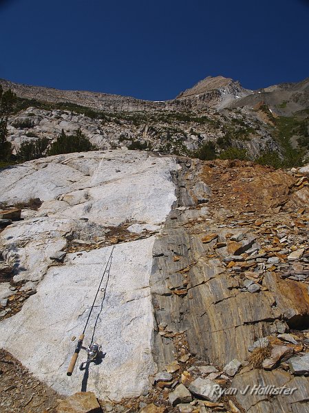 20090816_20_Lakes_Basin_0320.JPG - Talk about all sorts of crazy here!  My rod is on the rocks for scale.   A great contact.