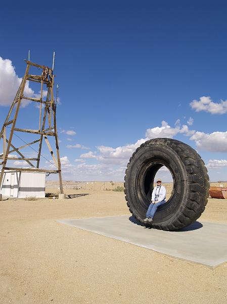 _2170709.JPG - Laura sits in one of the tires used by the dump trucks at the Borax Mine.