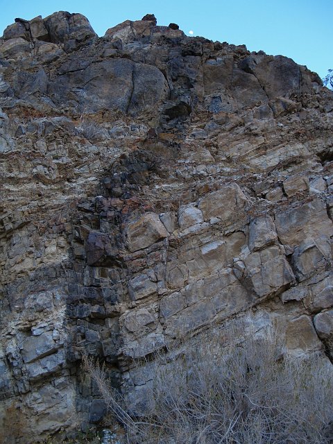 _2150557.JPG - This the canyon that harbors Darwin Falls.  Some neat basaltic dikes have cross-cut this canyon. Note the moon at the top?