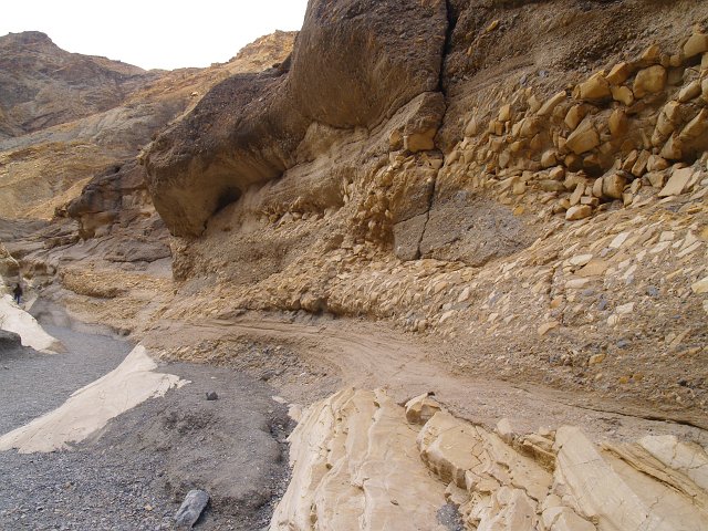 _2180792.JPG - This is the namesake of Mosaic Canyon:  chunks of dolomite marble were deposited and cemented together, then as the canyon uplifted, the floods have cut back through the old deposits.