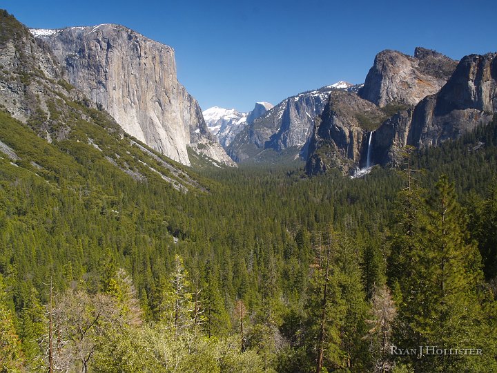 _4047835.JPG - Ah... a picture-perfect day from the Wawona Tunnel View.  Bridalveil falls at right, El Capitan at left and Half-Dome in the distance.
