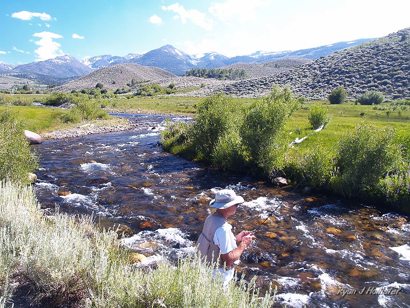 _7110289.JPG - My dad's starting to get hte knack of stream fishing.