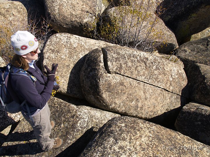 _A125276.JPG - Laura checks for broken bones in her hand after karate-chopping the boulder.   She put a good dent in it!