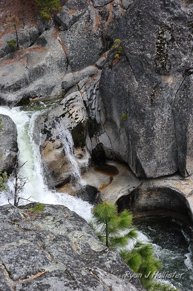 RJH_1751.JPG - This water in nearly 50 feet below us.  The large rounded out sections are potholes carved by the swirling water grinding granites cobbles against the bedrock.