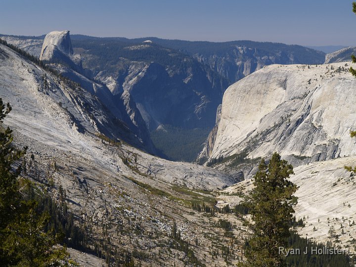 _9235199.JPG - Where the trail to Sunrise splits to go towards Clouds Rest & Half Dome, I ran into a guy who said I might like the view just over the hill about 50 yards away.  Boy, was he ever right!  Tenaya Canyon in the foreground, Half Dome at left, and Yosemite Valley in teh dead center of the photo.   What a view!