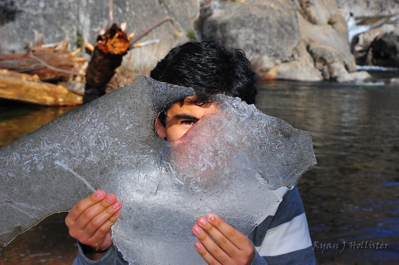 RJH_6655.JPG - Israel looks through his ice hole.