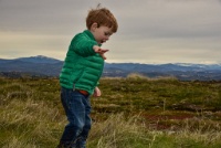 Zephyr had a great time "flying" his toy airplane into the grasses. : Geology Trip, Jamestown, MJC Geology, latite, southern motherlode, table mountain, vernal pool
