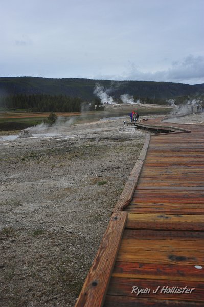 RJH_2623.JPG - It started pouring on us while we waited for darn geyser to go!  But the rain made the wooden boardwalks look beautiful.