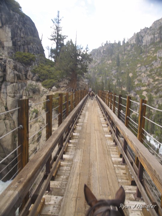 _6300051.JPG - Notice the gap between my horse & Laura's?  Her horse was unsteady going downhill and just took off galloping across the bridge once it had navigated some trecherous switchbacks.  I had visions of the horse with my wife jumping the railing into the canyon below.