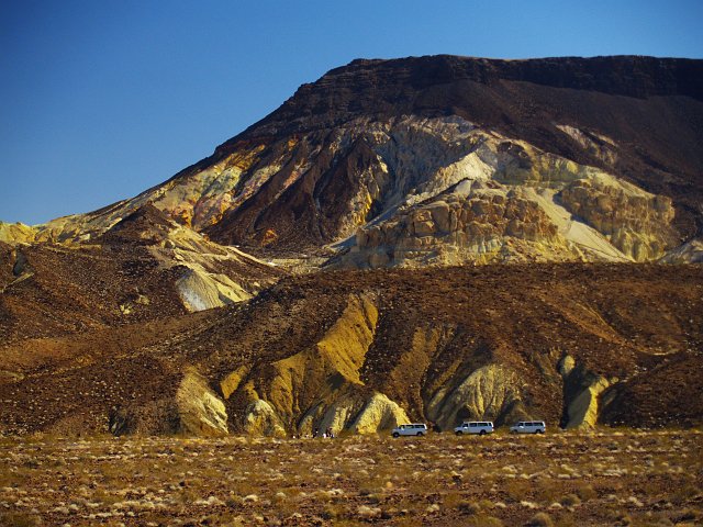 _2160610.JPG - Parked outside of the Ryan Mine.  I like the sense of scale that the vans bring.