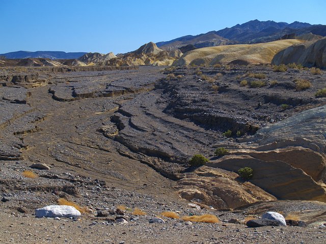 _2160645.JPG - This is the site of the 2004 flash flood that wiped-out 19 miles of highway and cut this channel in less than five hours time.  There was a diversion dam here to protect the Furnace Creek Inn.  It kinda worked, but 2 people still died.       See my 2005 photos of DV to see the fresh destruction.