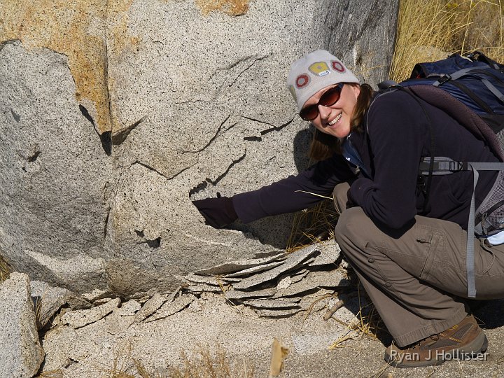 _A125271.JPG - I think sticking her hand in the granite flakes was Laura's trip highlight!