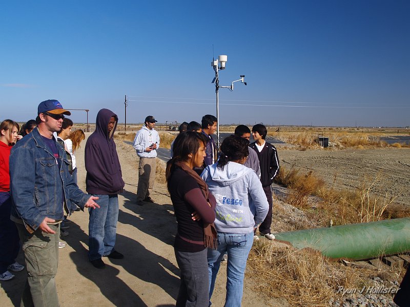 mendota_wildLink_111409_0912.JPG - Jason shows the large pipe that pumps many thousands of gallons per day when there's enough water to do so.