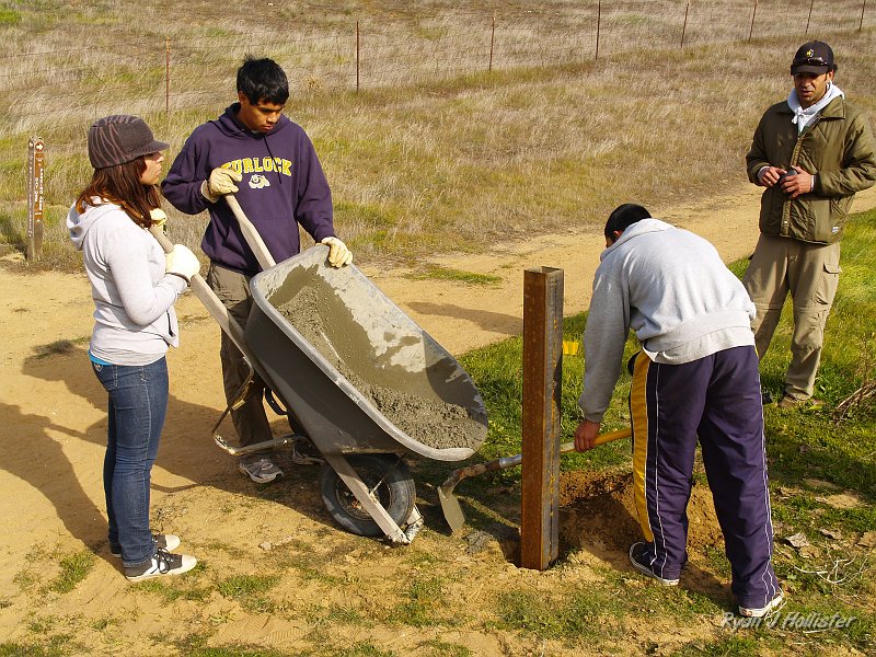 pacheco_120509_1040.JPG - After reaching 18-inches in depth, we mixed concrete and set the posts.